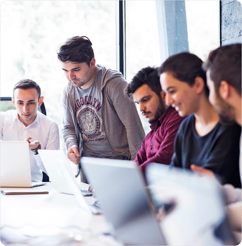 Students collaborating on embedded systems projects in Manfree Technologies lab